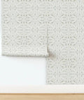 Workhorse Symmetrical Wallpaper With Pvc Free Type Ii Rating And Matte Texture Boasting Sturdy Linen Vibes For Busy Kitchens Bathrooms And Commercial Spaces Using Paste To Paper Installation For Pro Level Daily Results, showcasing a rolled beige pattern.