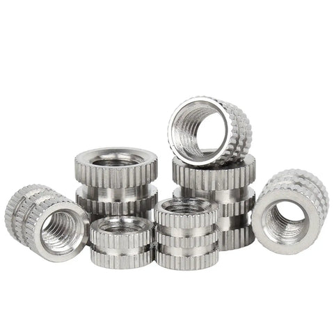 304 Stainless M3 Knurled Threaded Insert Nuts for Plastic Injection Molding and Hot Melt Embedment displayed in a stack