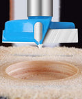Blue hex-shank carbide-tipped hinge boring hole saw cutter, front view drilling a 22mm hole in wood.