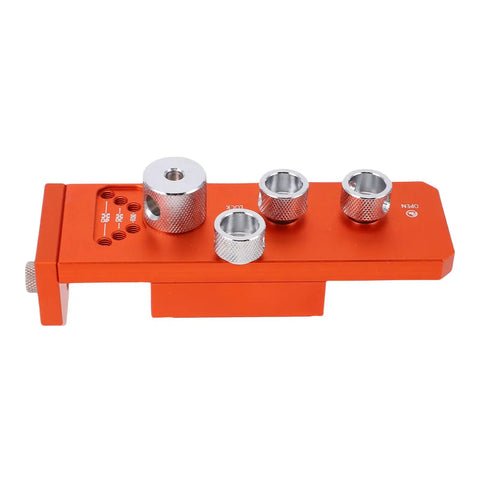 Heavy Duty Aluminum Drill Guide Tap Jig For Straight Shooting Thread Tapping And Reliable Industrial Machinery Assembly Projects That Get Done Right Every Single Time with an orange aluminum bracket and silver fittings.
