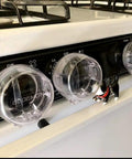 Clear 6 Pack Stove Gas Knob Covers For Kids Safety on black stove, adhesive install, no tools, double button design, no hinges visible