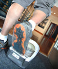 Applying Pro Grade Floor Guard Adhesive Film Refill Rolls For Protective Shoe Cover System on shoe