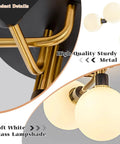 Close-up of sturdy black and brass metal with soft white frosted glass shades on a five-light mid-century modern milk glass globe ceiling light.