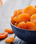 Bowl of dried apricots prepared using the Kickass Efficient Digital Food Dehydrator Featuring Five Generous Trays And Smart Temperature Controls For Whipping Up Crunchy Jerky Dried Fruits And Savory Herb Flakes Fast.
