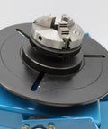 3 Jaw Rotary Welding Positioner Turntable With 2.5 Inch Mini Lathe Chuck showing the chuck and round platform for steel pipe flanges.