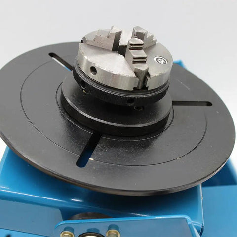 3 Jaw Rotary Welding Positioner Turntable With 2.5 Inch Mini Lathe Chuck showing the chuck and round platform for steel pipe flanges.