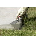 Applying Quick Set Cement And Mortar Mix In A Ten Pound Pail Bonds Concrete Brick And Block In Ten Minutes Flat with trowel.