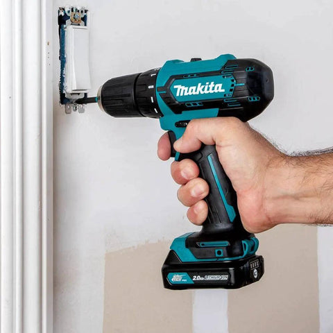 12V Max Cordless Drill Driver Kit With 3/8 In Chuck Two 2Ah Batteries Renewed Variable Speed 0 to 450 and 0 to 1700 RPM being used on wall