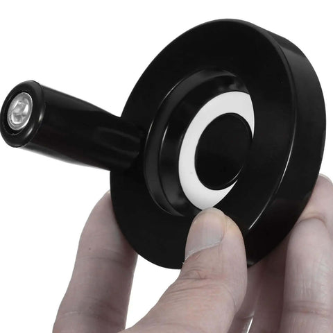 Close-up of hand holding Dual Installation Black Bakelite and Aluminum Alloy Crank Handle Grip for Milling Machines with upgraded grip.
