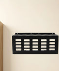 Heavy Duty Wall Mount Caulk Tube Holder Rack holds eleven adhesive cartridges upright, black metal design mounted on wall.