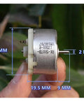 Close-up of Mini 32mm Round Spindle Motor, DC 6V 9V 12V, 5600 RPM with size details, held by hand for humidifiers and DIY projects
