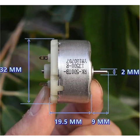 Close-up of Mini 32mm Round Spindle Motor, DC 6V 9V 12V, 5600 RPM with size details, held by hand for humidifiers and DIY projects