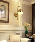 Retro Industrial Wall Sconces Featuring White Glass Ball Shades And Durable Iron Base To Amp Up Any Room For Bathroom Vanity Or Bedroom Decor Hardwired Wall Lamps With Warm Vibe For Living Room in gold finish.