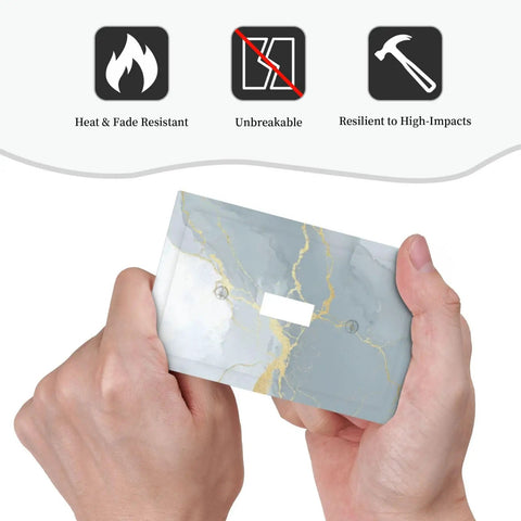 Totally Dope Grey And Gold Marble Single Toggle Switch Cover Plate With Bold Abstract Patterns Durable Plastic, held in hands.