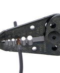 Close-up of a 7 In 1 Wire Stripper And Cable Cutting Tool For Stranded Solid NM And UF Wire Pro Grade Electrician Hand Tool in use