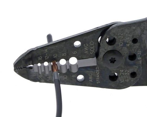 Close-up of a 7 In 1 Wire Stripper And Cable Cutting Tool For Stranded Solid NM And UF Wire Pro Grade Electrician Hand Tool in use