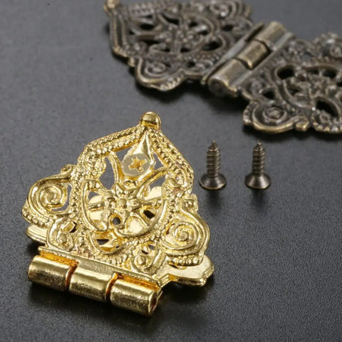 Snag The Goods On These Rad Antique Lace Hinges 10 Piece Set Zinc Alloy With Mounting Screws Gray 53 X 28 Mm close-up of gold hinge with screws