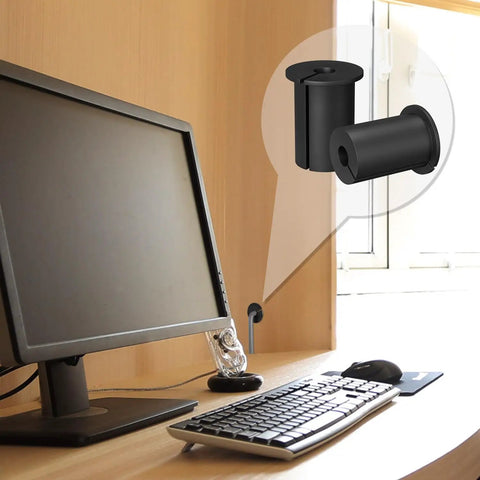 Slick Starlink Cable Routing Kit And Wall Grommet For One Inch Holes shown near computer, featuring black rubber bushings for clean cable routing.