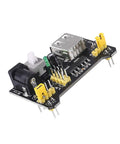 Kickstart Your Prototypes With This Straight Up Dope 3.3V 5V MB102 Breadboard Power Supply Module With No Fuss Toggle Switch And Battery Cable Perfect For Arduino Tinkering Smooth Operation Always On Tap Pack Of Three - black circuit board with USB ports and connectors