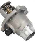Built Tough Thermostat Housing Direct Swap Compatible With Bmw 550I 650I And X5 Series Engine Cooling Assembly side view showing spring and inlet.