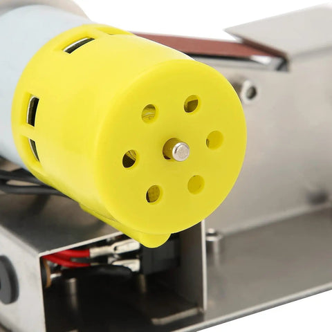 Close-up of the yellow motor on the Pro 200W Mini Belt Sander Electric Polishing Grinder, showcasing its design and assembly.
