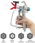 Hand holding spray gun featuring 5 Pack Reversible Airless Spray Tips Set For Paint Sprayers 211 313 415 517 623 Stainless Steel 304 Nozzles