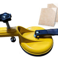 Floor Gap Fixer Tool With Suction Alignment, showing yellow clamp and suction cup next to tile, for laminate vinyl wood and tile flooring.