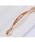 Heavy Duty Zinc Alloy Cabinet Pulls And Drawer Knobs Knockout Amber Gold Finish straight cabinet pull on white surface.