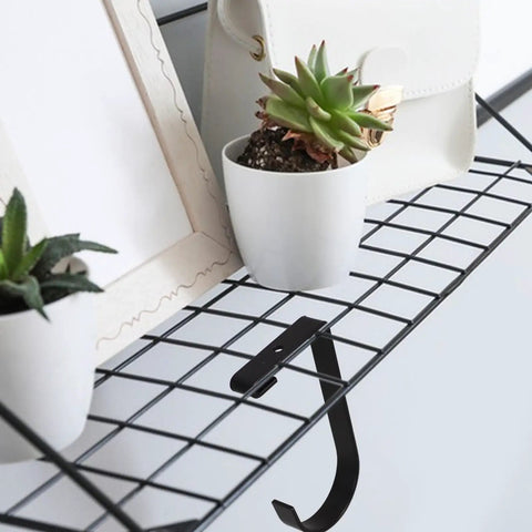 Four Pack Overhead Garage Storage Hooks Black Heavy Duty Ceiling And Wall Hanging Hooks installed on wire shelf with decor