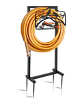 Freestanding Metal Garden Hose Holder With Four Spikes And Detachable Water Hose Hanger Organizer For Outdoor Use Heavy Duty Hose Reel Keeps Your Yard Tidy Plus Back Hooks For Sprinklers Shovels Rakes More, shown with coiled hose and tools.