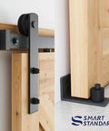 Close-up of Heavy Duty Sliding Barn Door Hardware Kit In Black, Includes Pull Handle Set And Floor Guide, Fits 34 To 36 Inch Door Panels.