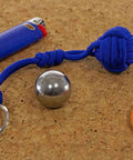 Stainless Steel Ball Bearings Set For Knots And Macrame, Heavy-Duty Hardware For Home Repairs, shown with a blue cord and lighter