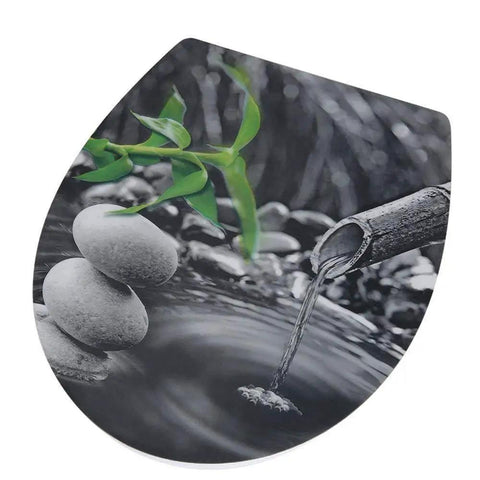 Elongated Toilet Seat With Super Smooth Slow Close Lid, Heavy Duty Rust Proof Chrome Hinges, Top Tier Durable Wood Surface, Rock Solid Build For Zero Sweat Home Renovations, decorated with stones and bamboo.