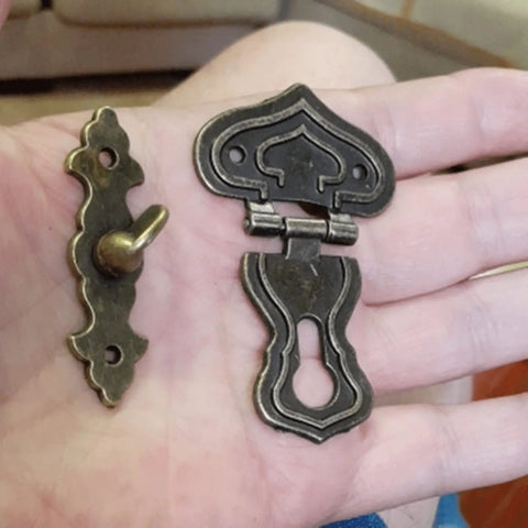 Five Piece Set Of Retro Antique Bronze Heart Shaped Box Hasp Lock Latches featuring tough zinc alloy construction in hand.
