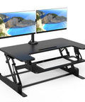 Dual Monitor Standing Desk Converter with 36 Inch Wide Surface Height Adjustable Riser Manual Lift Gas Spring Built In Two Monitor Mounts