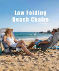 Low Profile Folding Beach Chair Twin Pack with Mesh Back on sandy beach, featuring cup holder and lightweight design.