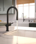 hansgrohe Talis N Pull Down Kitchen Faucet, Modern, Magnetic Hand Sprayer, 1-Handle, 1.75 GPM, Matte Black, 72865671 with water flowing