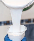 Pouring white enamel into cup for Pour On Tub And Tile Reglazing Kit For Sinks And Tubs, DIY Bathroom Remodel With Gloss White Finish