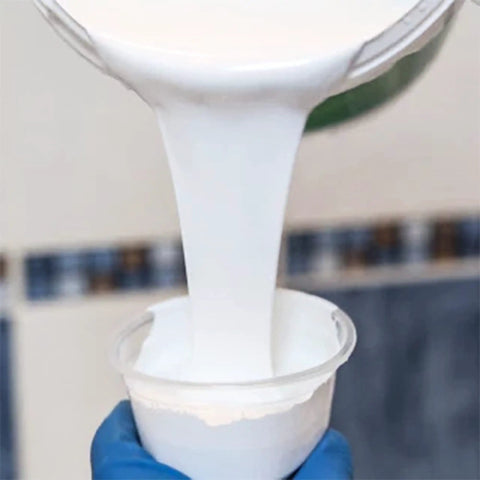 Pouring white enamel into cup for Pour On Tub And Tile Reglazing Kit For Sinks And Tubs, DIY Bathroom Remodel With Gloss White Finish
