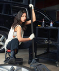 Woman using Beefy Floor Jack Handle Replacement for 3 Ton Horizontal Hydraulic Jacks, showcasing steel and rubber construction.