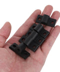 Hand holding 10 Pack Aluminum Profile Corner Brackets for Extrusion Frames Black Mounting Plates Five Millimeter Thick