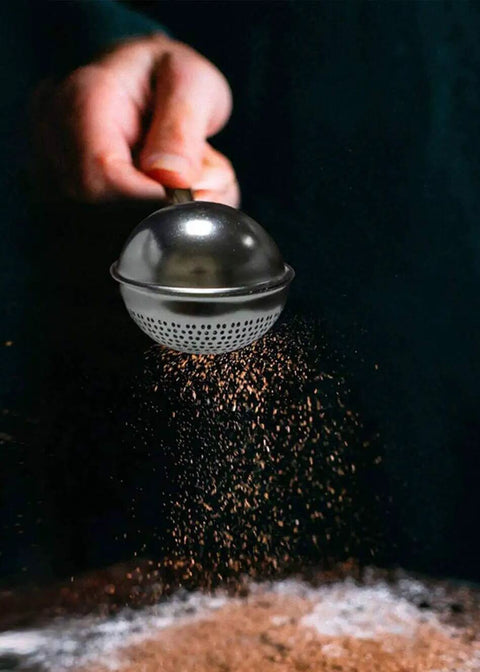Flour Duster For Baking One Handed Operation Stainless Steel Powdered Sugar Shaker Duster in use dusting cocoa powder
