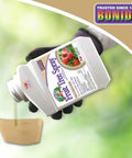 Hand pouring Fruit Tree Spray Concentrate For Organic Gardening Insect And Disease Control Protects Apple, Pear, Citrus And Nut Trees From Powdery Mildew, Blight, Black Spot, Mold And Other Fungal Attacks 16 oz Concentrate into a container