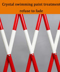 Heavy Duty Slick Retracting Metal Barrier Gate And Quick Fold Down Mobile Fence With Smooth Rolling Wheels For Tight Crowd Areas. Close view of red and white retractable barrier.