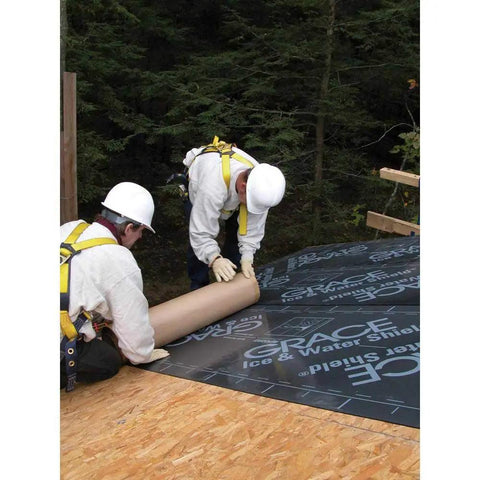Workers laying Rock Solid Self Adhering Ice And Water Shield Roof Underlayment 36 Inch By 66.6 Feet on a roof.