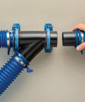 Dust Right Ready-Mount 2.5 Inch Vacuum Hose Fitting Brackets with interlocking teeth design securing vacuum hoses on wall.