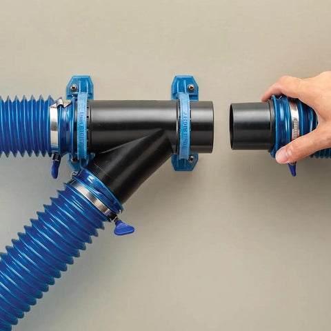 Dust Right Ready-Mount 2.5 Inch Vacuum Hose Fitting Brackets with interlocking teeth design securing vacuum hoses on wall.