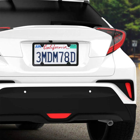 Lock Your Plates Down Tight With These Sleek Black License Plate Screws Featuring Tamper Proof Anti Theft Design Made From Sturdy One Quarter Inch Stainless Steel For Quick Install And Heavy Shield Against Highway Hooligans And Dust visible on a white car with California license plate.