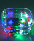 5 Pack LED Fishing Lights For Deep Water Drops inside a clear bowl, emitting multicolored lights underwater, water activated auto on.