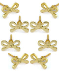 Set Of 8 Brass Bow Knobs For Cabinets And Drawers, Decorative Bow Hardware, shown in a circular layout, each with nuts and washers.
